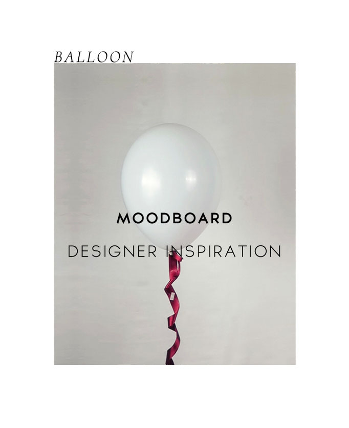White standing balloon with red ribbon